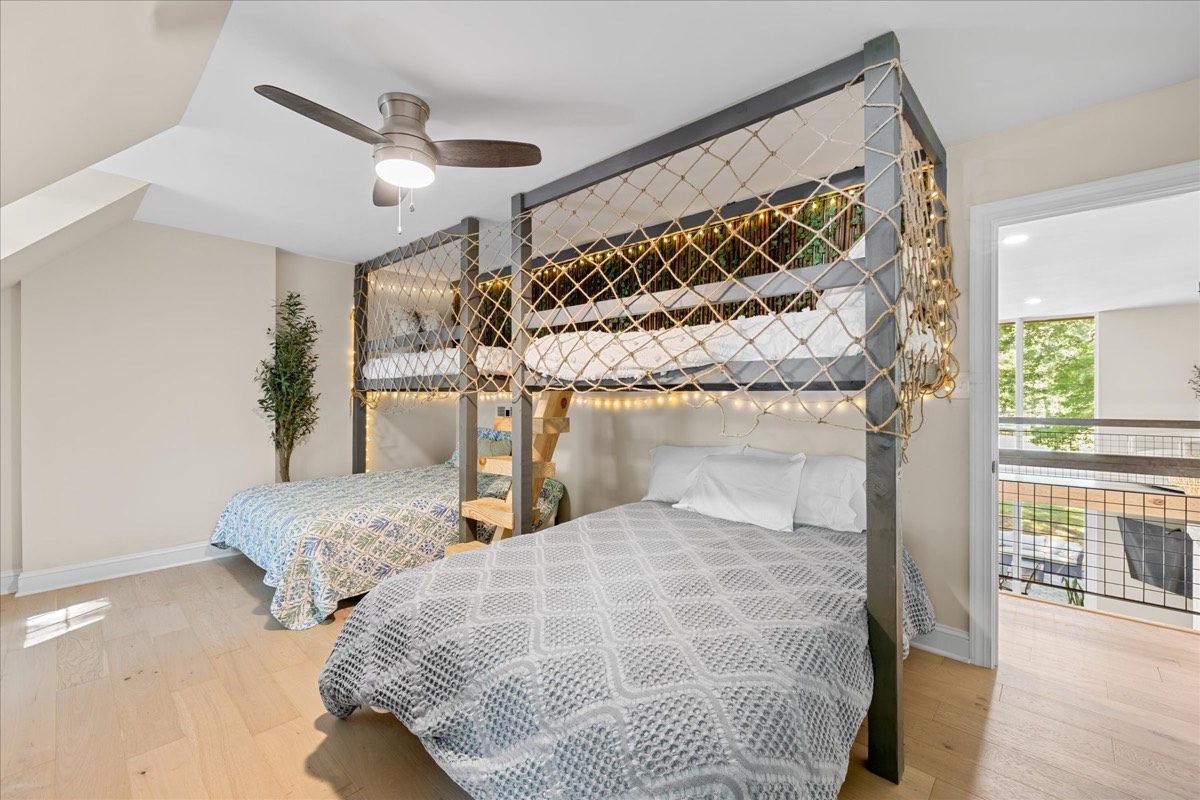 Fun bunk room with rope netting and string lights — kids love this room